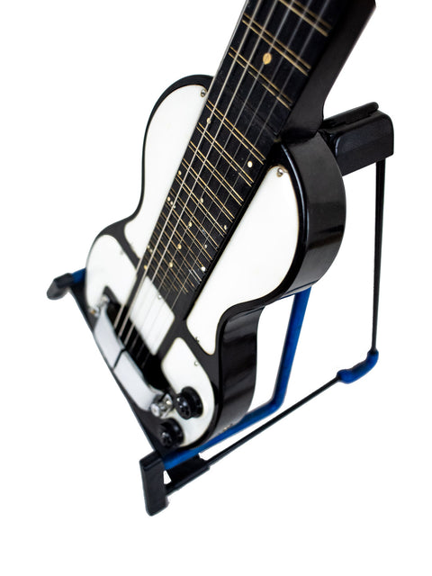 Vintage 1930s Rickenbacher Electro Lap Steel guitar on a blue stand, showcasing its white strings.