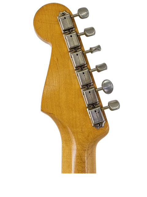 Vintage 1958 Fender Stratocaster neck in close-up, revealing intricate details and craftsmanship of this classic guitar.