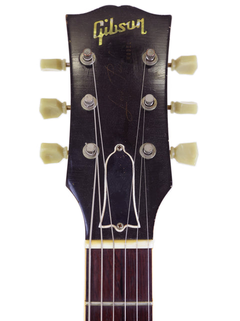 Vintage 1962 Gibson Les Paul Custom, featuring iconic design elements and enhancements from the 2006 Custom Shop reissue.