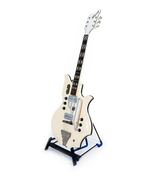 Vintage 1962 National Valco Glenwood Model 99 guitar in white, displayed on a stand with a striking blue base.