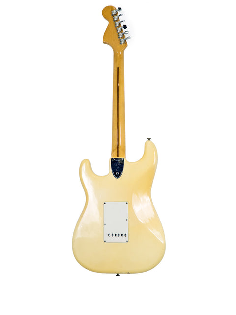 Vintage 1976 Fender Stratocaster electric guitar, white with a wooden body, exemplifying iconic American guitar design.