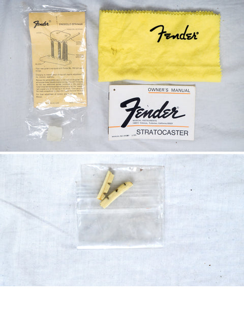 Vintage 1976 Fender Stratocaster guitar strings, representing classic American craftsmanship and musical excellence.