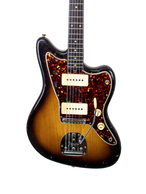 Vintage Fender Jazzmaster from 1960, adorned with a beautiful sunburst finish, exemplifying classic guitar artistry.