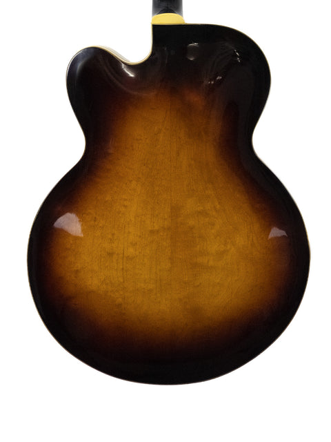 Vintage Gibson L-5 CES from 1955, showcasing a sunburst finish and Alnico pickups, a true guitar masterpiece.