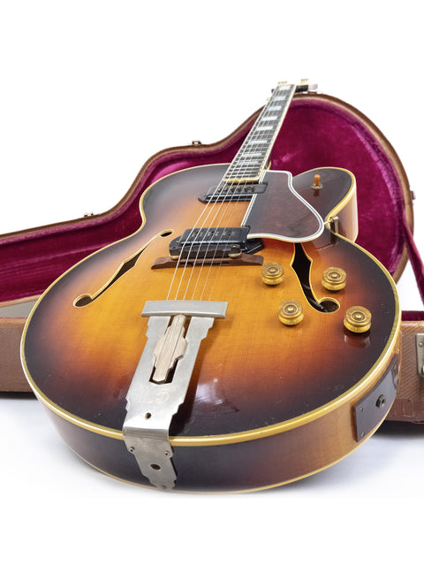 Vintage Gibson L-5 CES guitar from 1955 with Alnico pickups, securely placed in its protective case.