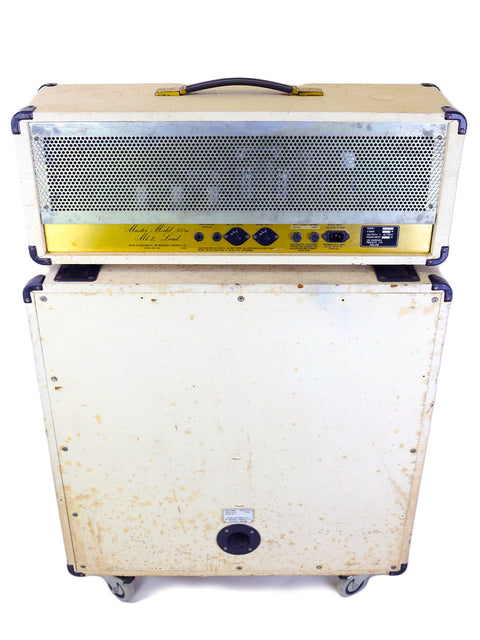 White and yellow Marshall JCM800 guitar amp on wheels, with a 4x12 cabinet, showcasing vintage style from 1984.