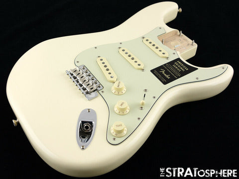 White electric guitar with a black pick guard, styled as a Fender '60s Strat Partscaster, Olympic White, Custom Shop USA 2020.