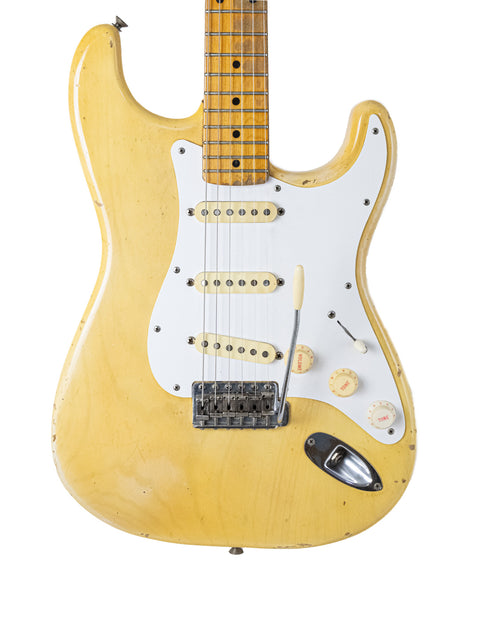 Yellow 1959 Fender Stratocaster electric guitar featuring a white pickguard and a classic maple neck design.