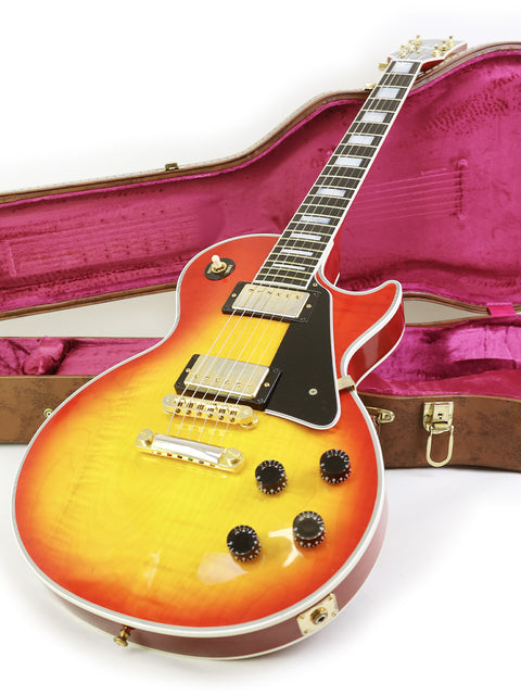 beautifully crafted 2014 Gibson Custom Shop Les Paul Custom guitar resting in its case, emphasizing its classic style.