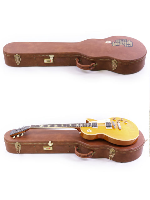 case holds two guitars, prominently displaying a yellow Gibson Les Paul Classic 1960 Reissue from 1991, highlighting its design.