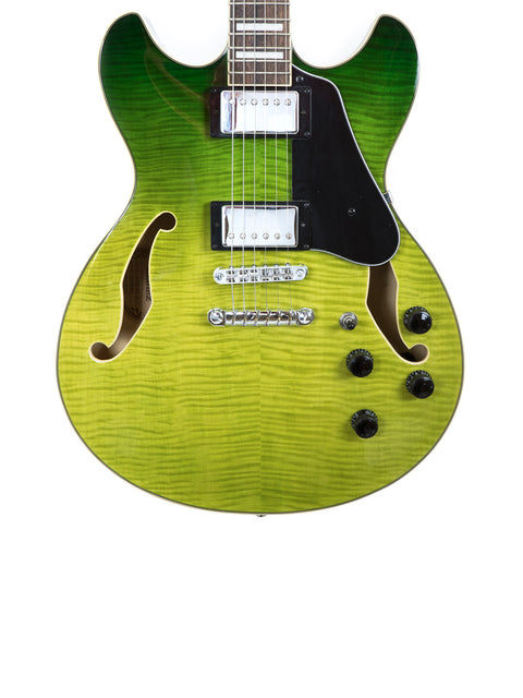 green Ibanez Artcore AS73 FM guitar with a black body and black pickup, showcasing its semi-hollow design and vibrant color.