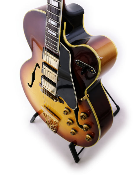 The iconic 1959 Gibson ES-5 Switchmaster guitar rests on a stand, highlighting its timeless craftsmanship and beauty.