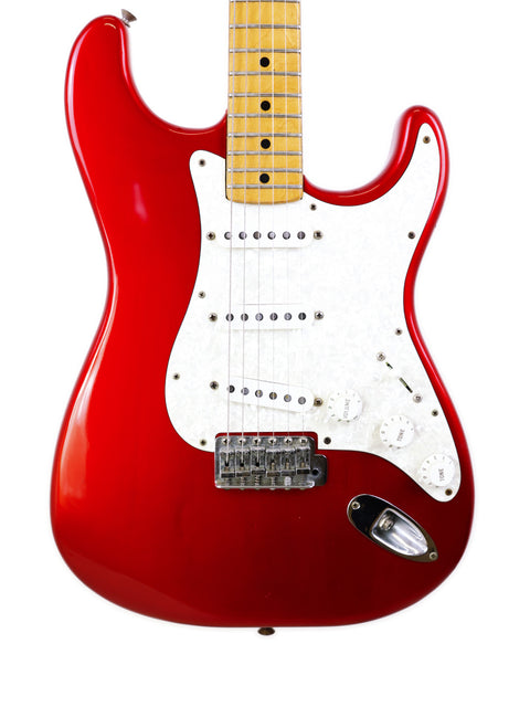 red Fender Stratocaster electric guitar with a white pickup, showcasing its classic design from 1979.
