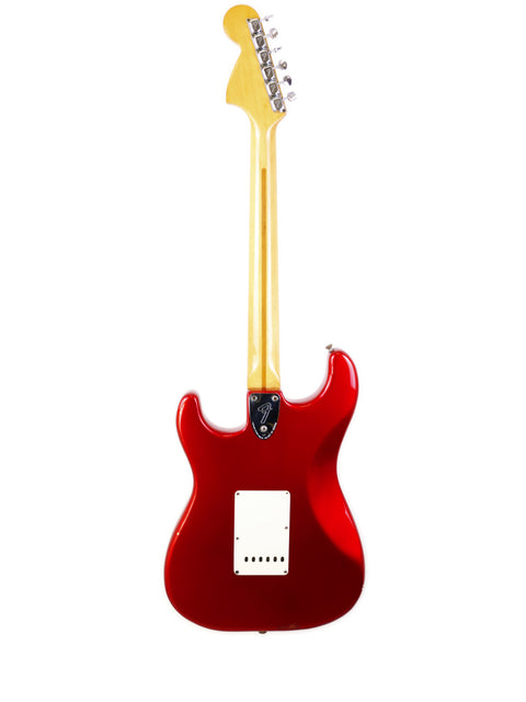 red electric guitar with a white body, showcasing a Fender Stratocaster Refin from the USA, model year 1979.
