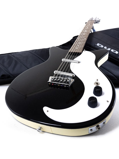 stylish black and white electric guitar with its case, representing the Danelectro DC59 12 String made in Korea, 2020.