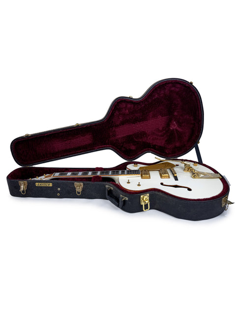 white guitar case featuring a gold neck and red elements, depicting the Gretsch G7593 White Falcon from Japan, 2012.