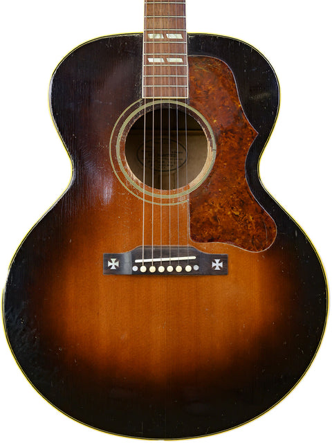 1951 Gibson J-45 in sunburst, a vintage acoustic guitar known for its rich tone and iconic style.