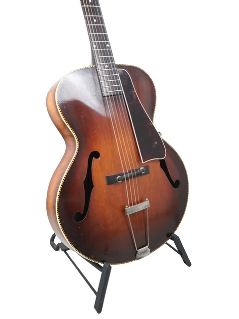 1952 Gibson J-45 electric guitar, a vintage piece representing the craftsmanship of the 1938 Kalamazoo KG-32.