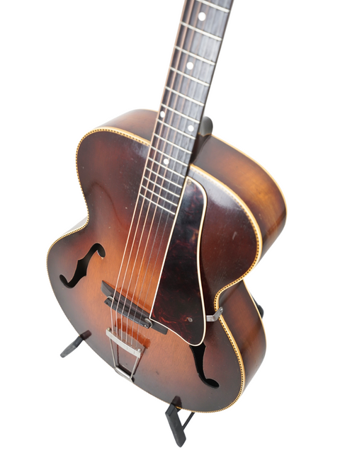 1952 Gibson J-45 sunburst electric guitar, a vintage piece reflecting the artistry of Kalamazoo craftsmanship from 1938.