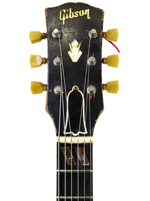 1961 Gibson Les Paul Custom Jumbo, a vintage electric guitar known for its iconic style and exceptional tone.