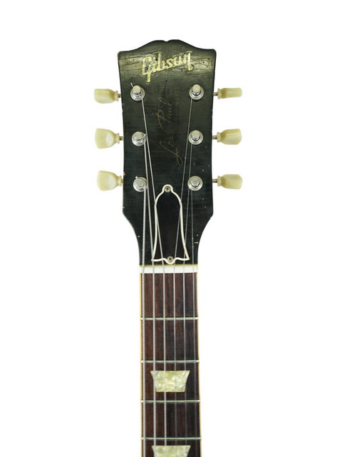 1961 Gibson Les Paul Standard, featuring a relic finish, representing iconic design and quality from the Gibson Custom Shop.
