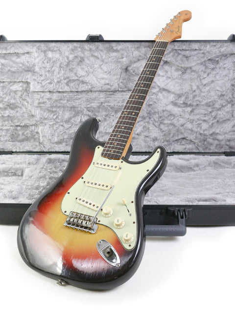 1963 Fender L-Series Stratocaster guitar in a case, elegantly presented against a white background.