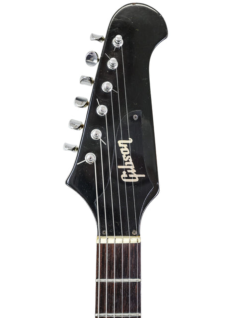 1966 Gibson Non Reverse Firebird III guitar in black with a contrasting white headstock, a true vintage piece.