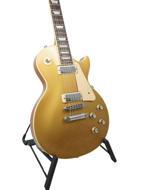 2000 Gibson Les Paul Standard Goldtop, a Limited Edition 30th Anniversary model, known for its timeless style and superior sound.