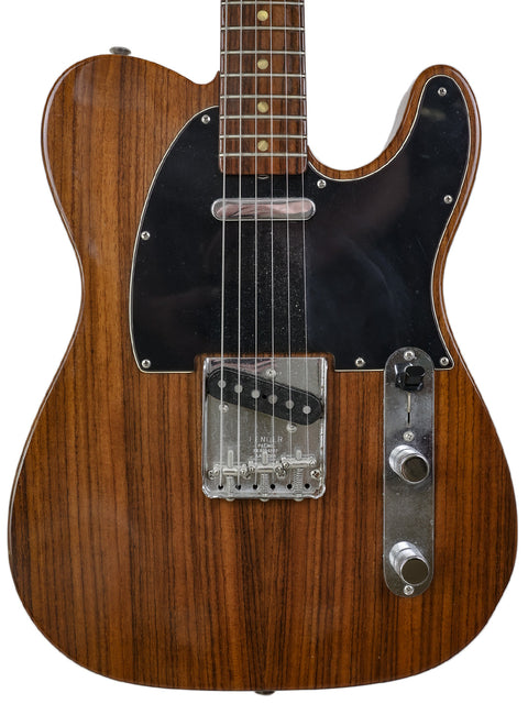 2003 Fender Masterbuilt Telecaster featuring a wooden body and black pickup, highlighting its unique design and quality.