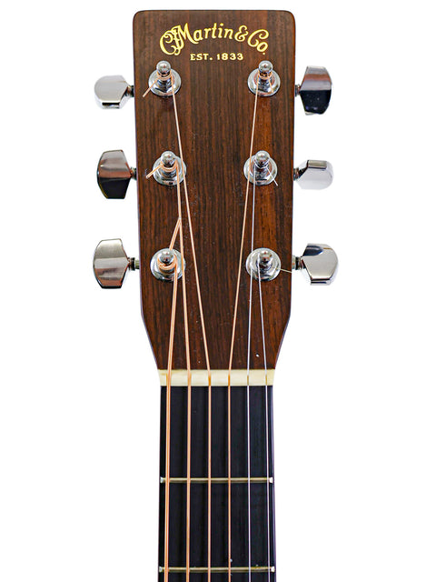 2006 Martin HD-28 acoustic guitar, featuring a rich wood finish and elegant detailing.