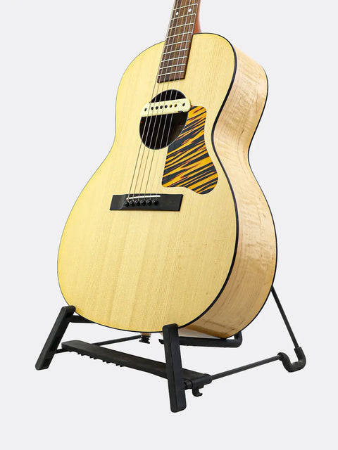WL-14 Scissortail acoustic guitar on a stand against a light gray background