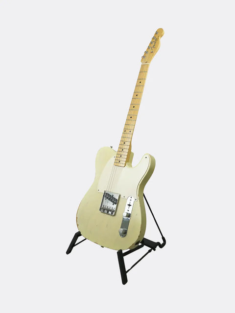 Fender Custom Shop '59 Esquire guitar on a stand against a white background