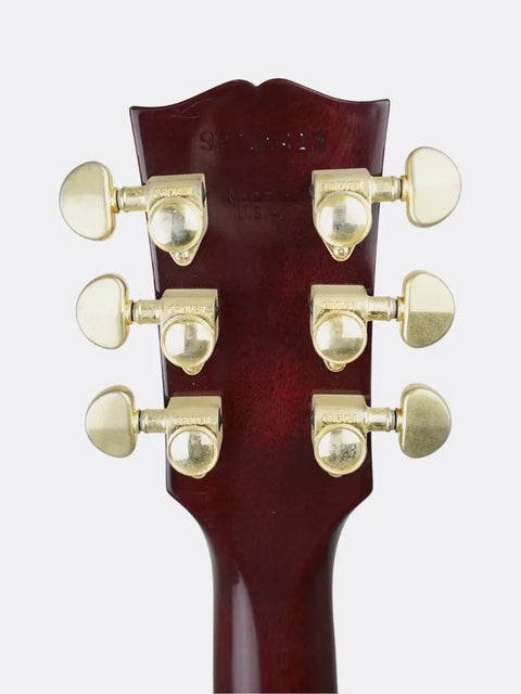 Close-up of a  1995 Gibson Jimmy Page Signature Les Paul headstock with tuning pegs on a white background