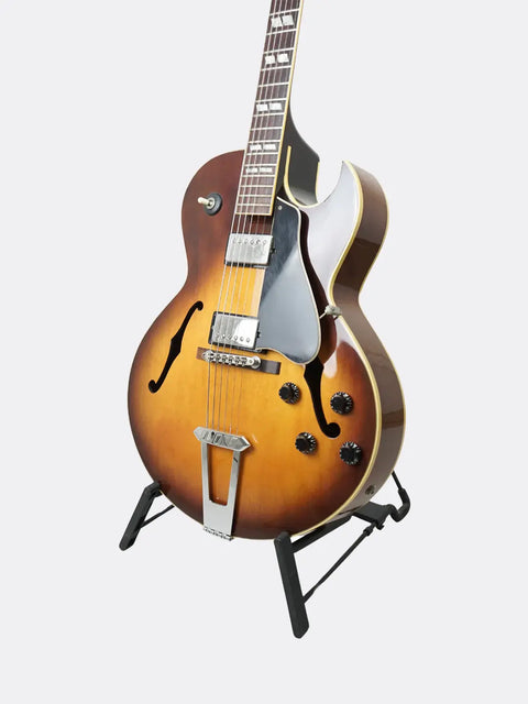 Gibson ES-175 guitar on a stand against a white background