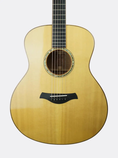 R. Taylor Style 1  guitar with a natural wood finish on a white background