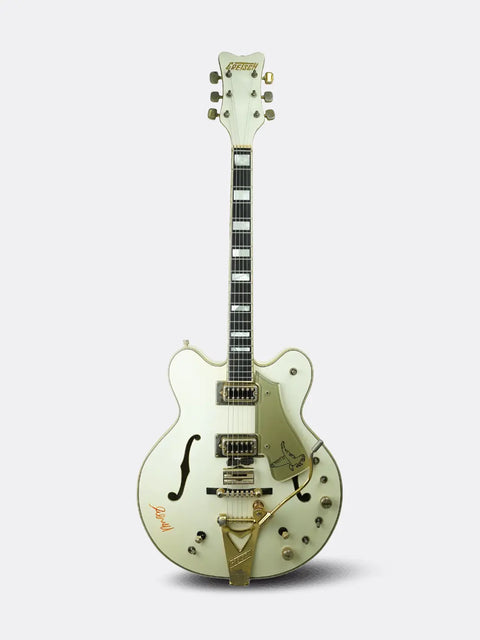 1972 Gretsch White Falcon with gold accents on a white background