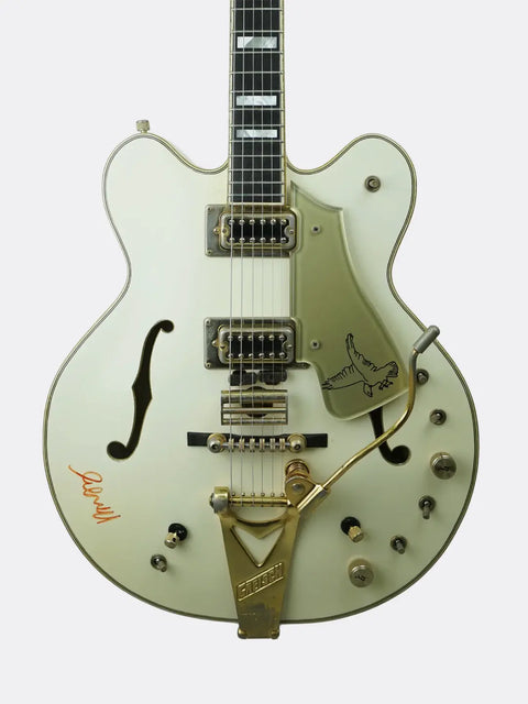 1972 Gretsch White Falcon with gold accents on a white background