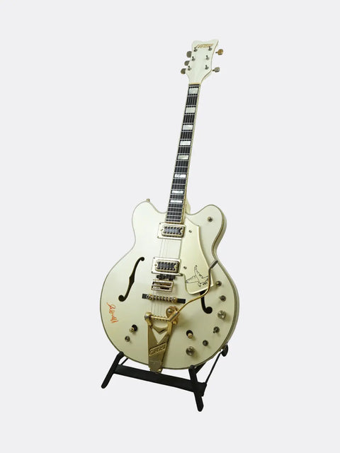 1972 Gretsch White Falcon on a stand against a white background