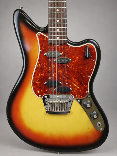 1965 Fender Electric XII guitar showcasing a vibrant sunburst finish paired with a chic black pickguard.
