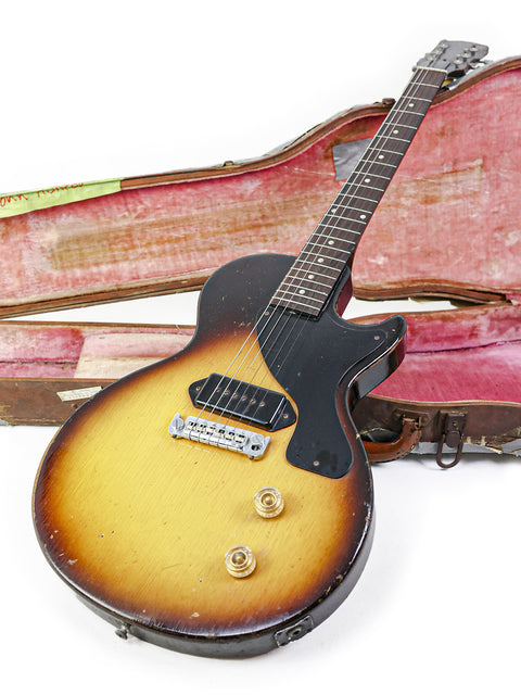A 1958 USA-made Gibson Les Paul Jr in TV Yellow securely placed in its case, reflecting its vintage charm and artistry.
