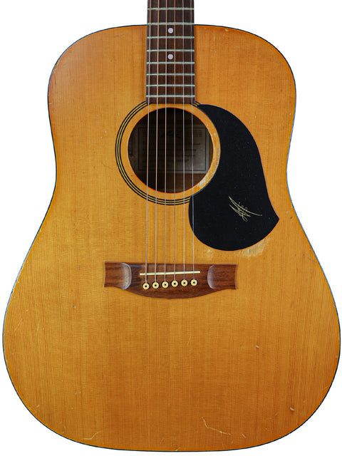 A 1962 Gibson D-28 acoustic guitar alongside a 1996 Maton M225 from Australia, celebrating vintage and modern guitar artistry.