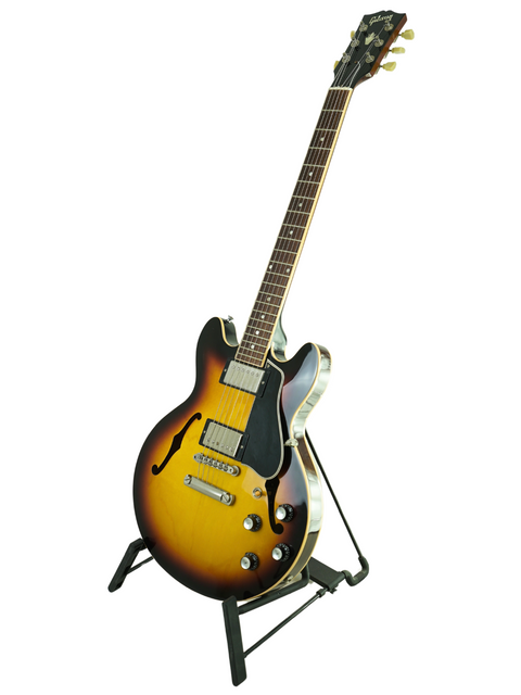 A 2009 Gibson Custom Shop ES-339 Memphis guitar resting on a stand, highlighting its classic shape and rich finish.