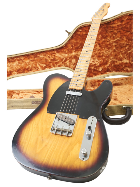A 2012 Fender Custom Shop 50's Telecaster NOS guitar displayed within its protective case, emphasizing its iconic style.