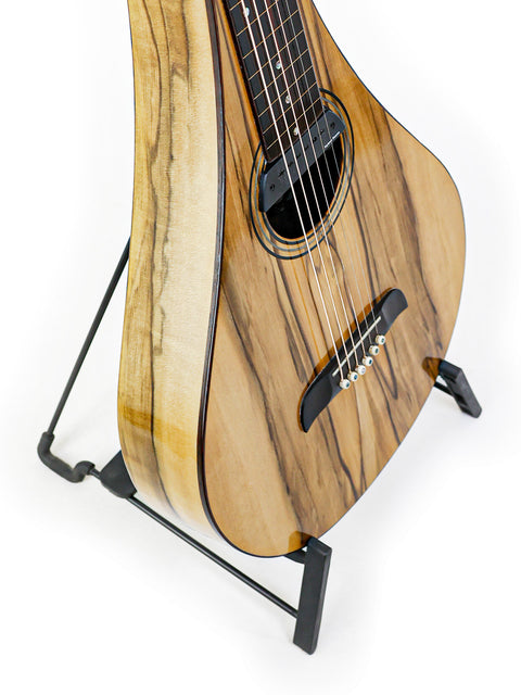 A 2013 Tim Kill Custom Teardrop guitar with a wooden body, elegantly positioned on a stand.