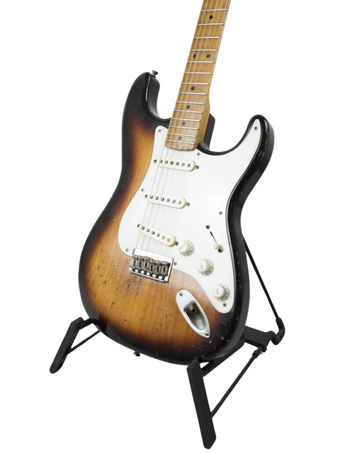 A 2024 Nacho Guitars 50s Stratocaster guitar on a stand, highlighted by a plain white background.