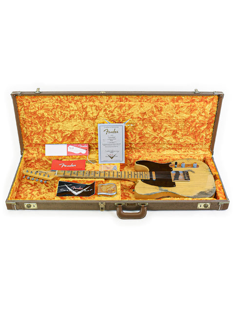 A Fender Custom Shop '53 Telecaster Heavy Relic guitar nestled inside a stylish guitar case.