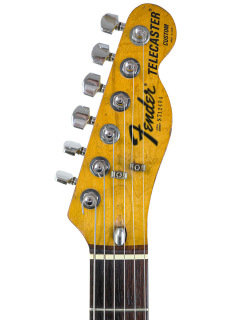 A Fender Stratocaster guitar featuring a single pickup, showcasing the classic design of the 1977 USA Telecaster Custom model.