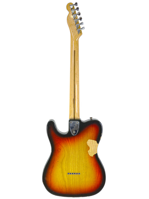 A Fender Telecaster Custom from 1977, featuring a striking sunburst finish on its body, showcasing classic craftsmanship.