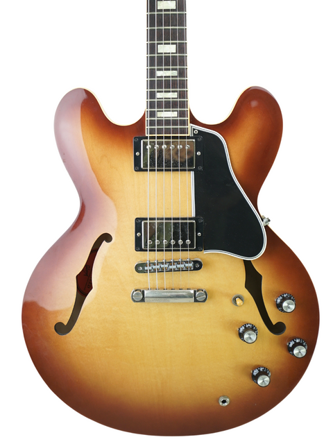 A Gibson Custom ES-335 guitar with a stunning sunburst finish, showcasing its Iced Tea color from 2012, USA-made.
