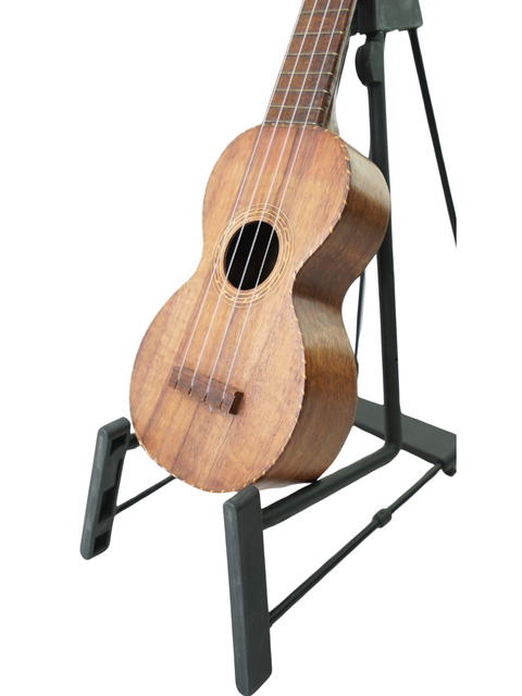 A Kumalae Model D ukulele, dating back to 1920, showcased on a stand, highlighting its vintage Hawaiian design.